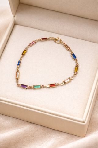 Pulsera dorada con piedras de colores