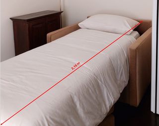 Poltrona letto beige in tessuto