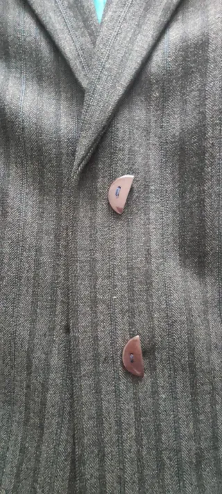 Traje de chaqueta y pantalón gris señora