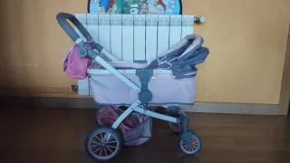 Carrito de muñecas rosa y gris