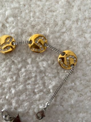 Pulsera Guess dorada y plateada con letras