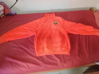 Chaqueta FC Barcelona Nike naranja.