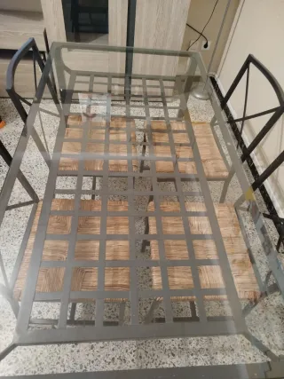 Mesa de comedor de cristal y hierro forjado