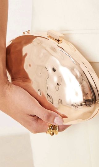 Bolso clutch rígido dorado ASOS