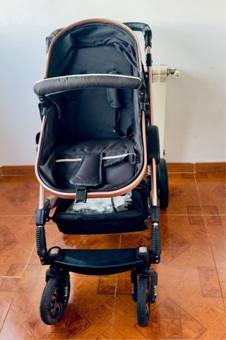 Cochecito de bebé negro y rosa