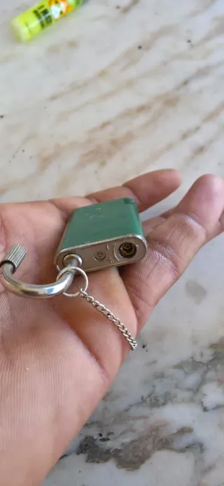 Mechero antiguo verde YSL la pulsera es plata