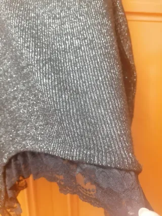 Jersey brillante negro y plateado