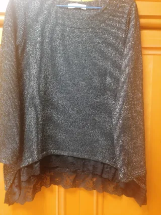 Jersey brillante negro y plateado