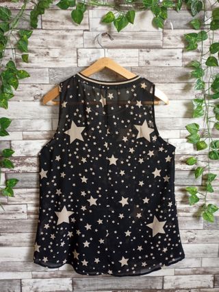 Top smanicato nero con stelle taglia S/M
