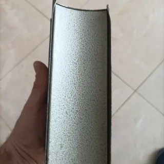 Salvadanaio libro antico metallo