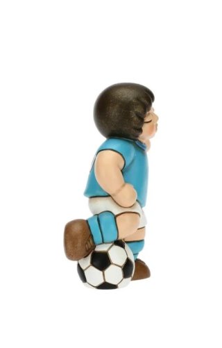 Thun calciatore azzurro con pallone