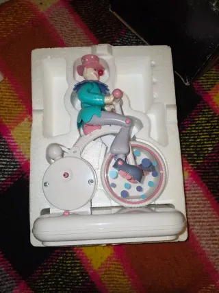 Carillon e sveglia clown su triciclo