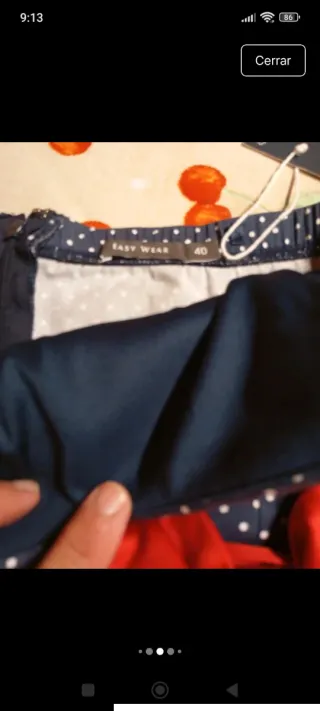 Vestido azul de lunares con lazo rojo