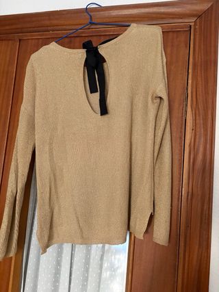 Jersey dorado con lazada negra