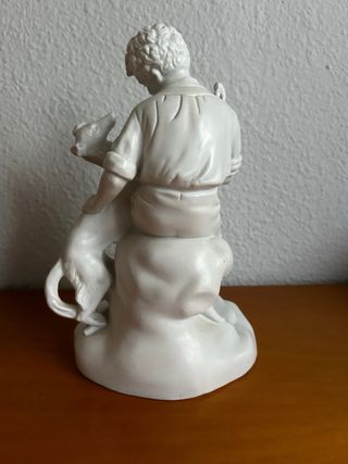 Figura porcelana niño con perro