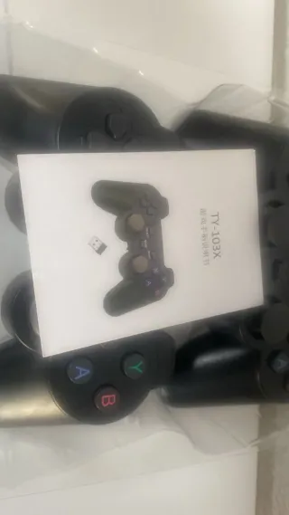 Super Console X con 2 mandos y accesorios