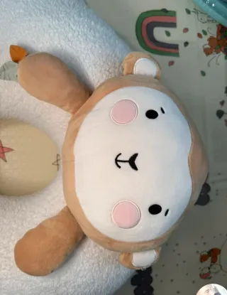 Cojín sensorial para bebé con peluche