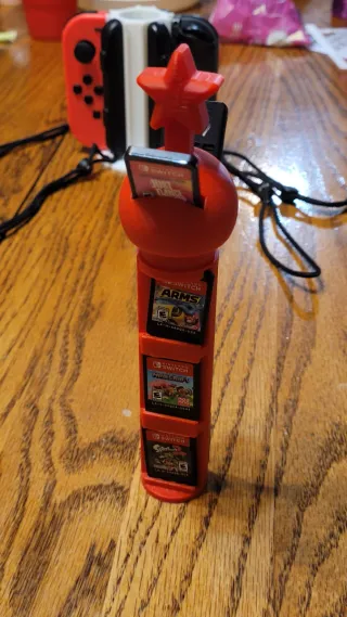 Soporte Joy-Con y juegos Nintendo Switch