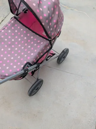 Cochecito de muñecas rosa lunares