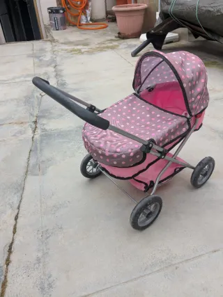 Cochecito de muñecas rosa lunares