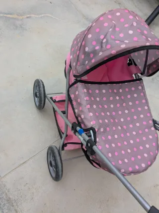 Cochecito de muñecas rosa lunares