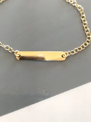 Pulsera bebé oro con corazón nueva.