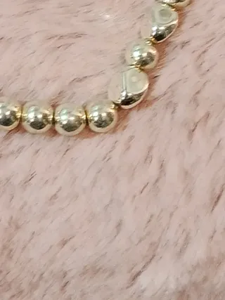 Pulsera de plata dorada con cuentas