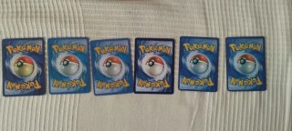 Charizard VMAX cartas Pokémon y variadas
