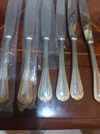Set coltelli acciaio dorati e argentati