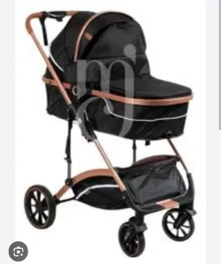 Carrito de bebé negro y cobre