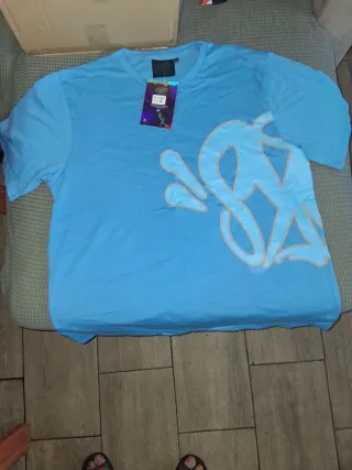 Conjunto Ami azul pantalon corto y camiseta.