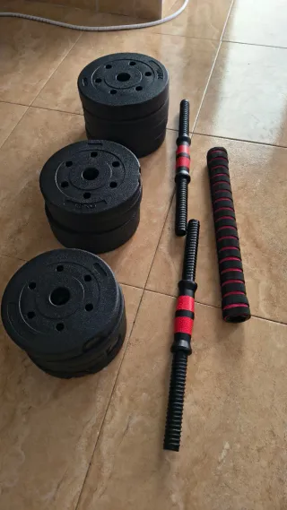 Banca de pesas con barra y discos