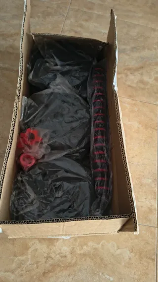 Banca de pesas con barra y discos