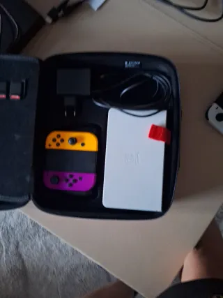 Nintendo Switch OLED blanca Naranja y Morado