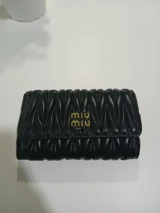 Borsa Miu Miu nera e dorata