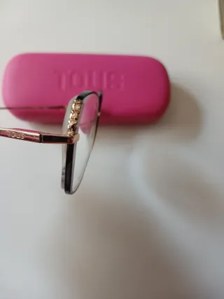 Montura de gafas Tous negra y dorada