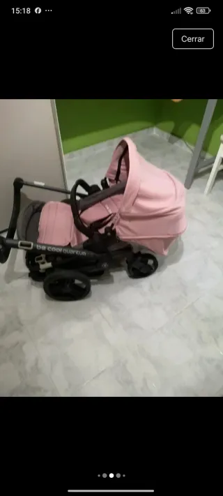 Carro de bebé rosa y gris
