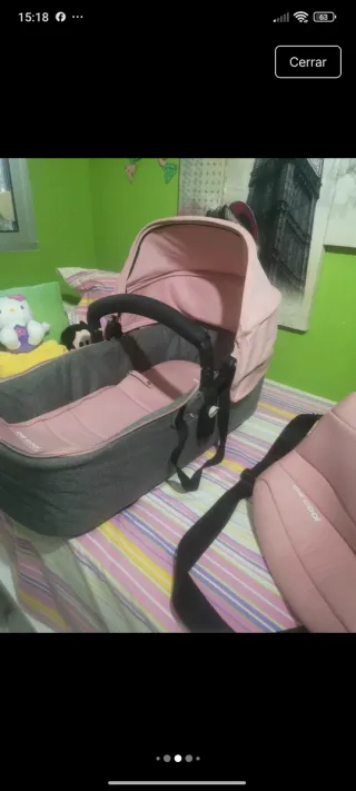 Carro de bebé rosa y gris