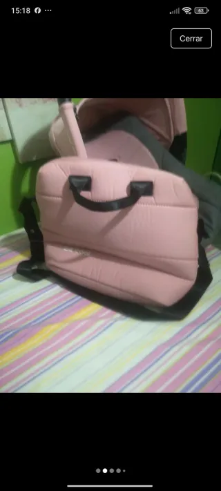 Carro de bebé rosa y gris