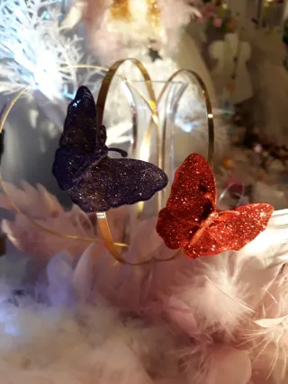 Diademas con mariposa y purpurina.Todos los colors