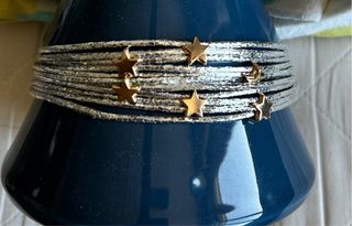 Pulsera combinada en plata y oro con estrellas