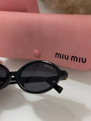 Occhiali da sole Miu Miu neri ovali