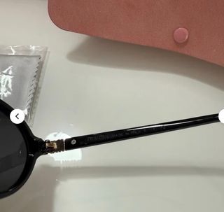 Occhiali da sole Miu Miu neri ovali