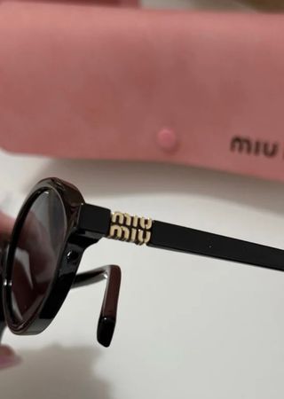 Occhiali da sole Miu Miu neri ovali