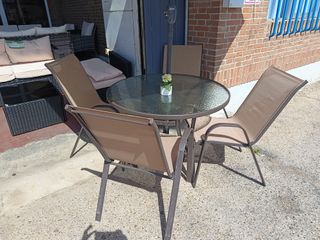 Mesa redonda cristal con 4 sillas exterior