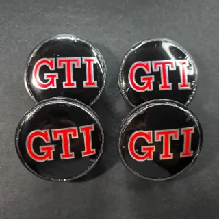 TAPABUJES VW GTI 65mm NEGROS - EMBLEMA VOLKSWAGEN