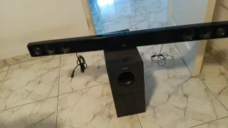 SMART TV LG 49 con barra de sonido y subwoofer