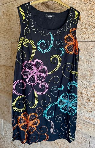 Gabardina Niza y vestido a estrenar