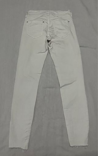 Pantalones skinny blancos rotos