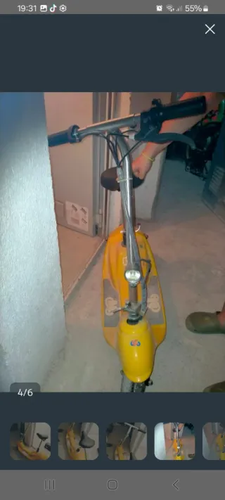 Patinete eléctrico vintage amarillo con asiento